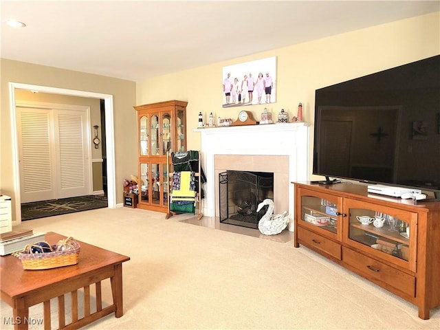 living room with a fireplace, carpet flooring, and recessed lighting