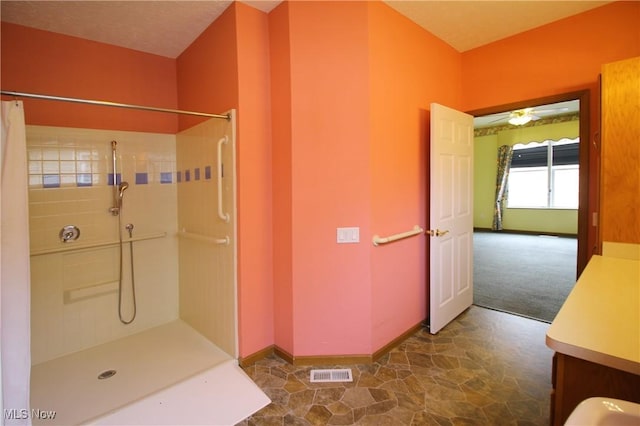 full bathroom featuring baseboards, visible vents, and a shower with curtain