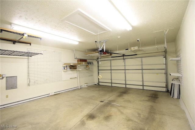 garage featuring baseboard heating