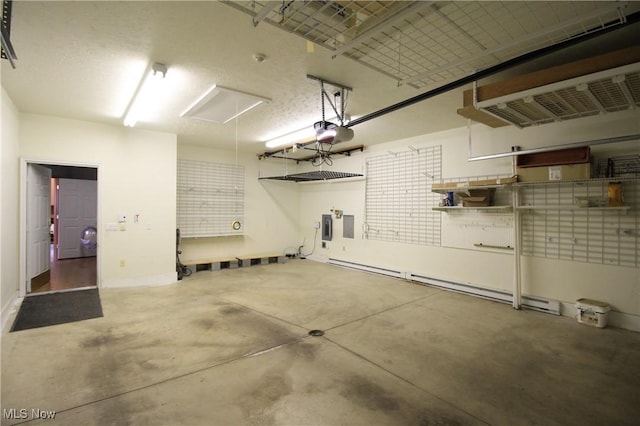 garage with a garage door opener and electric panel