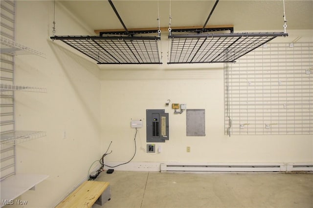 washroom featuring a baseboard heating unit and electric panel