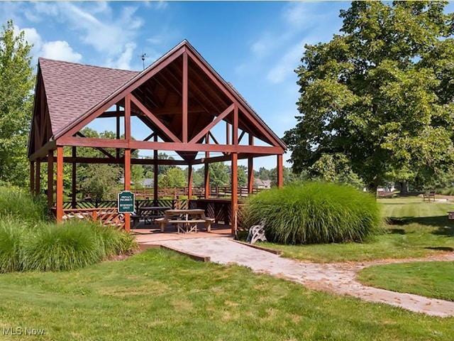 view of property's community featuring a lawn and a gazebo