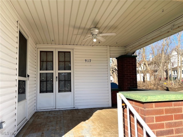 entrance to property featuring french doors and ceiling fan