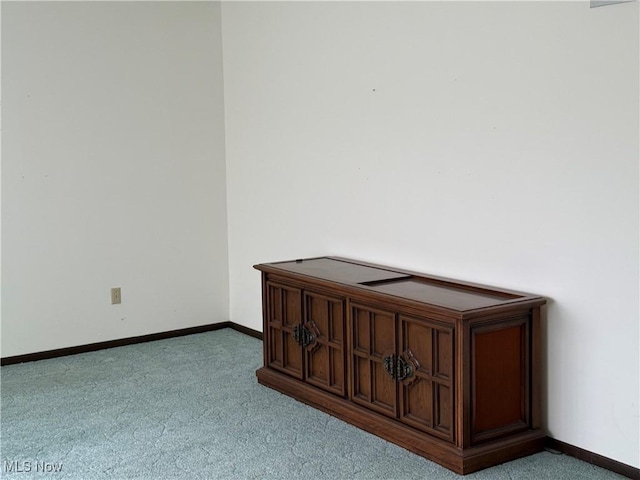 interior space featuring baseboards