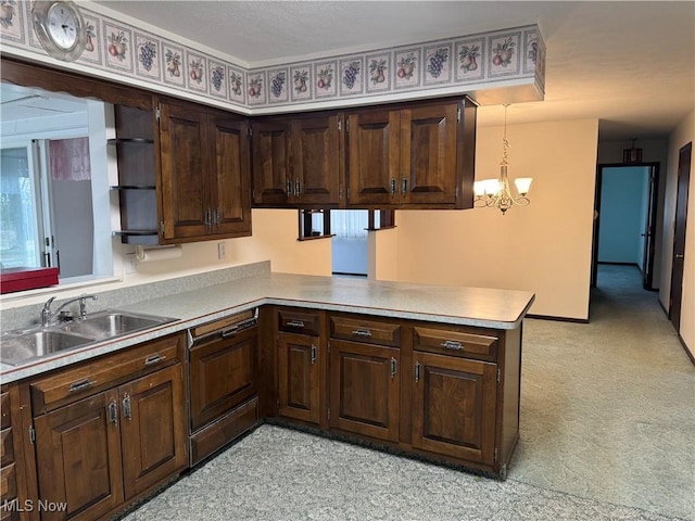 kitchen featuring dishwasher, a peninsula, dark brown cabinetry, and a sink