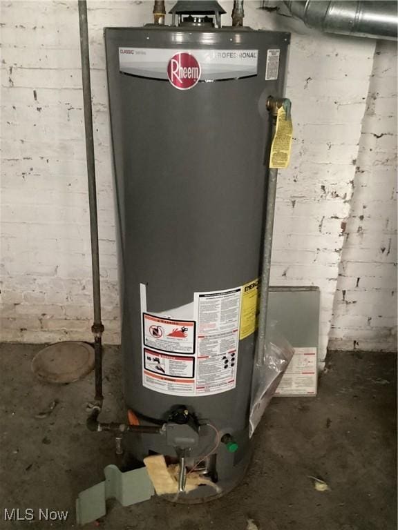 utility room featuring water heater