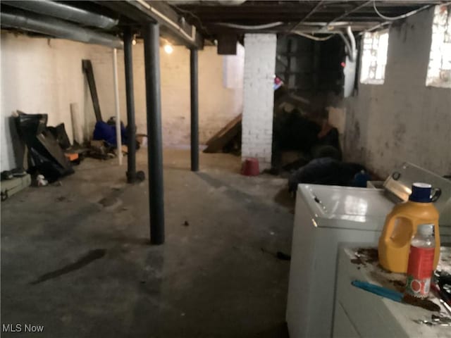 basement with washing machine and clothes dryer