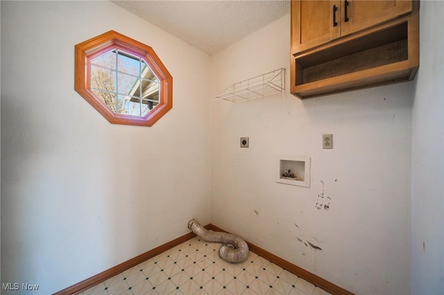 laundry room featuring light floors, baseboards, cabinet space, electric dryer hookup, and a textured ceiling