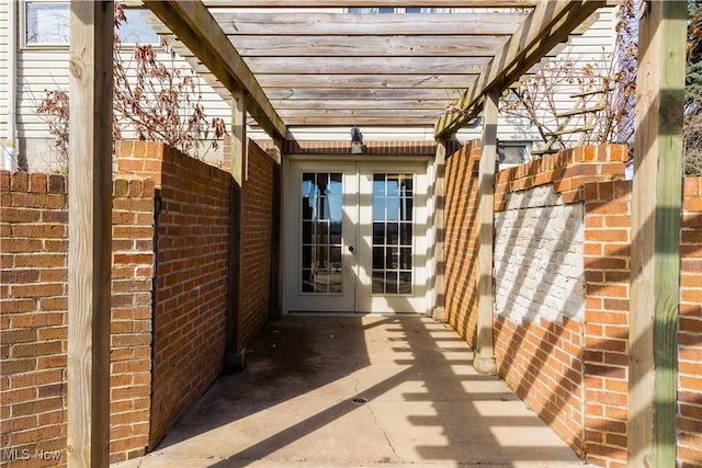 view of patio / terrace featuring french doors and a pergola