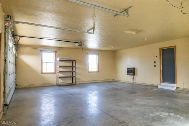 garage with heating unit and a garage door opener