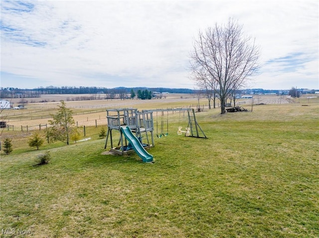 view of play area with a rural view and a lawn