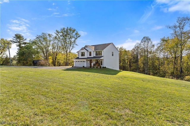 exterior space with an attached garage and a front lawn