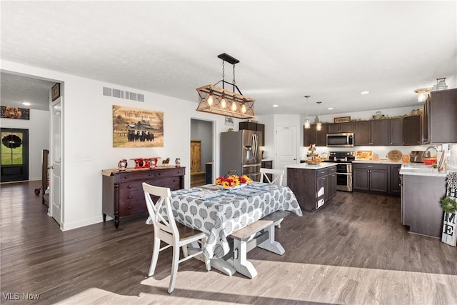 dining area featuring visible vents, recessed lighting, baseboards, and dark wood-style flooring