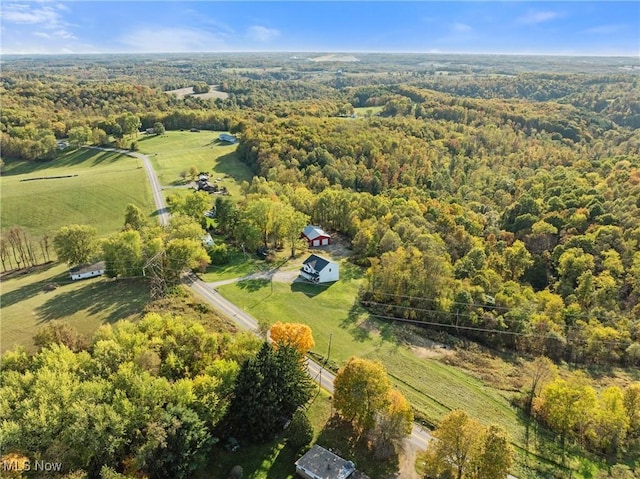 drone / aerial view with a rural view and a forest view