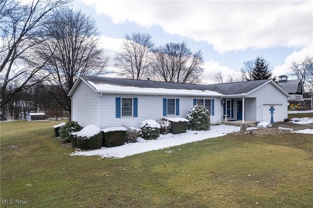 view of front of house featuring an attached garage and a front yard