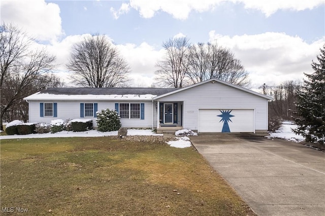 ranch-style home featuring a front lawn, an attached garage, and driveway