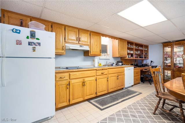 kitchen with white appliances, open shelves, light countertops, a paneled ceiling, and under cabinet range hood