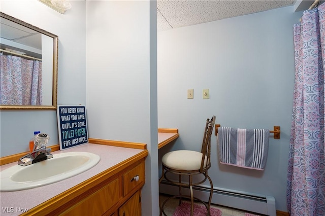 bathroom featuring vanity and a baseboard heating unit