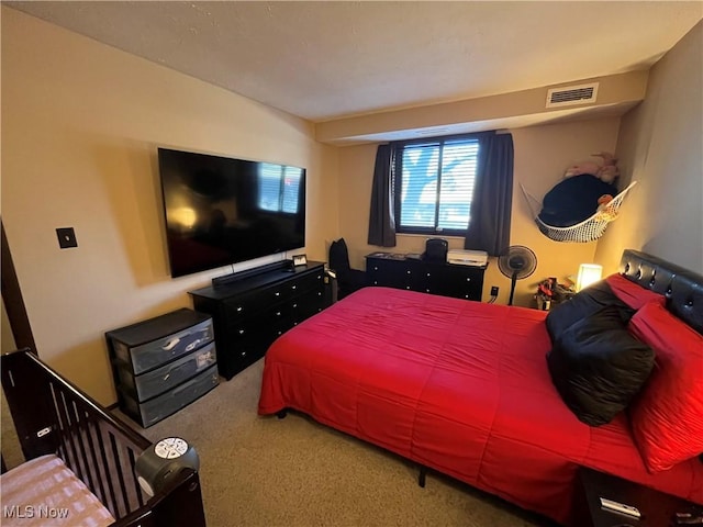 carpeted bedroom with visible vents