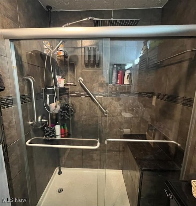 bathroom featuring a stall shower