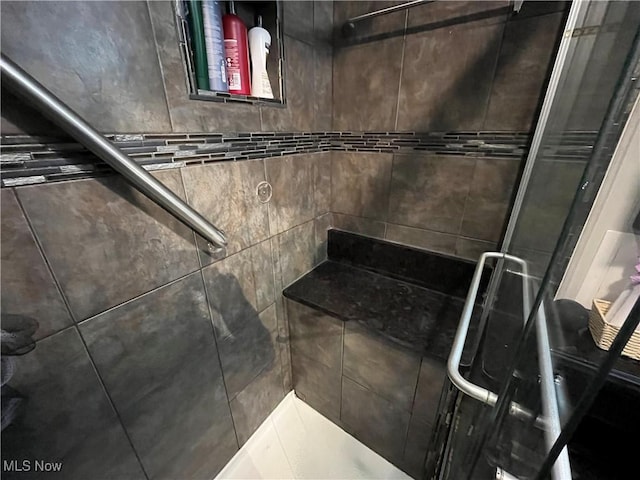 room details featuring a shower stall