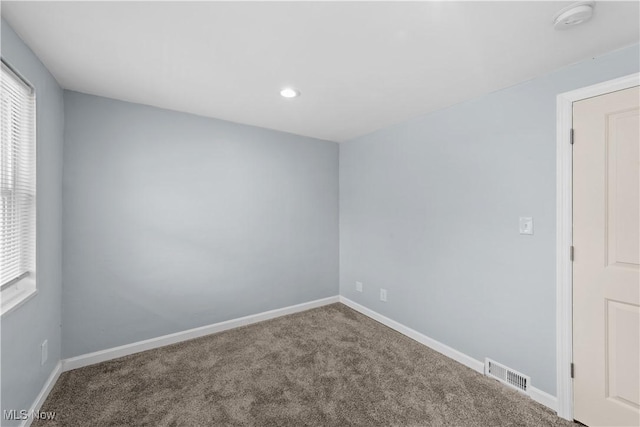 empty room featuring recessed lighting, visible vents, baseboards, and carpet flooring