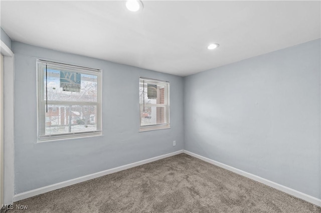 empty room with recessed lighting, baseboards, and carpet floors