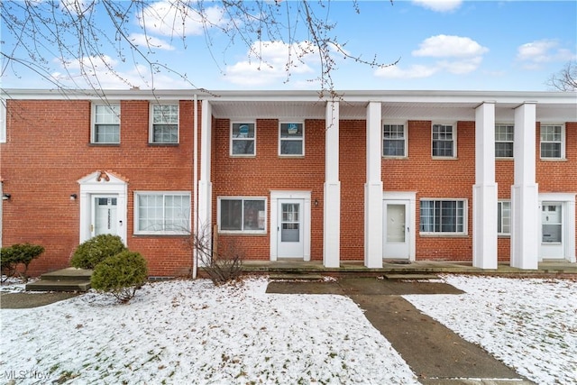 view of front of home featuring brick siding