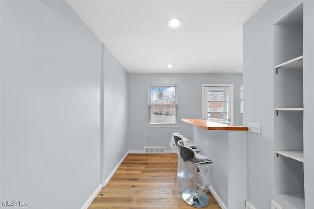 spacious closet featuring light wood-style flooring and visible vents