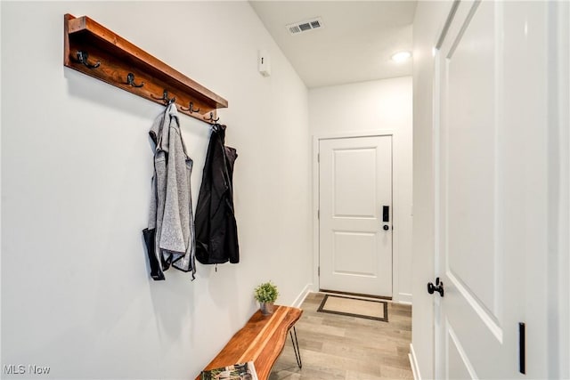 mudroom featuring visible vents and light wood-style flooring