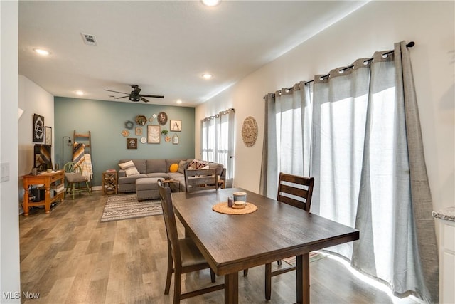 dining space with visible vents, recessed lighting, light wood-type flooring, and a ceiling fan