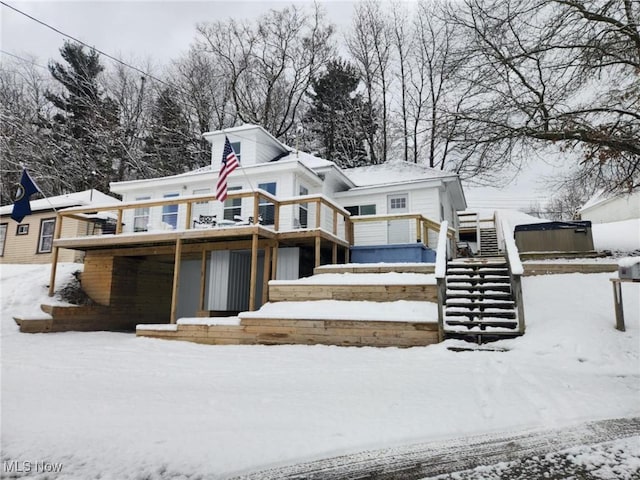 view of front of property featuring stairway