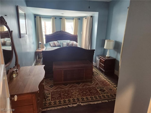 bedroom featuring baseboards