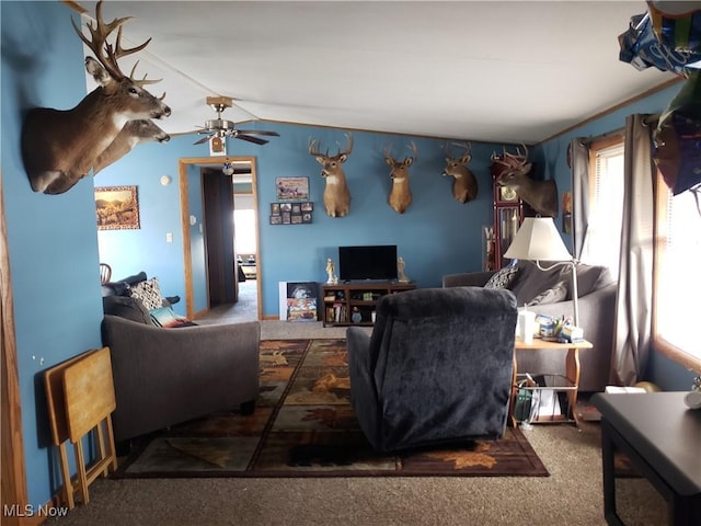 carpeted living room featuring vaulted ceiling