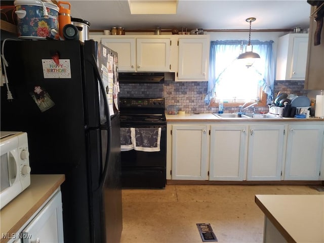 kitchen featuring black appliances, a sink, under cabinet range hood, tasteful backsplash, and white cabinetry