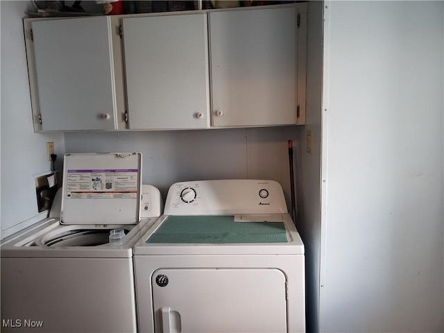 laundry area with cabinet space and washing machine and dryer