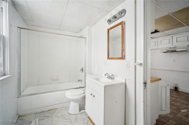 bathroom featuring shower / bath combination, vanity, toilet, and a paneled ceiling