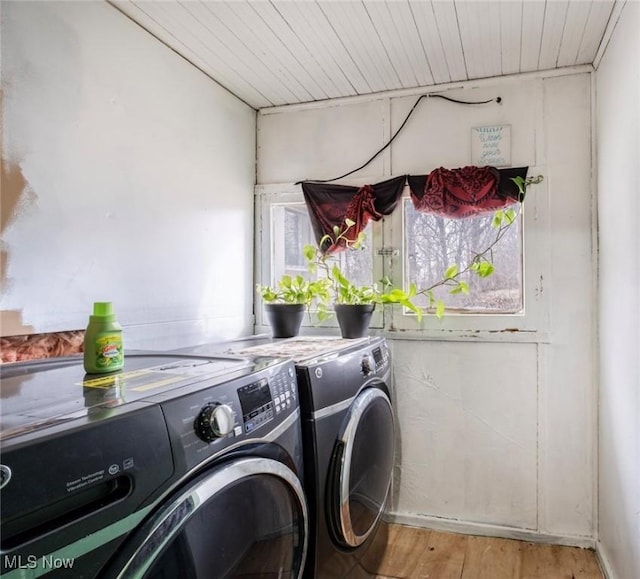 washroom featuring laundry area, wood ceiling, light wood-style floors, and independent washer and dryer