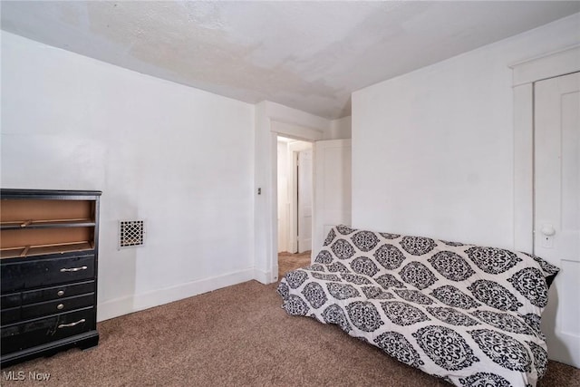 interior space with visible vents, baseboards, and carpet