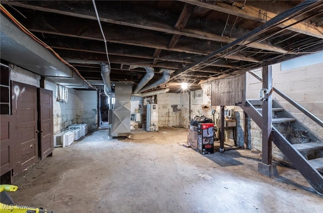 unfinished below grade area with gas water heater and heating unit