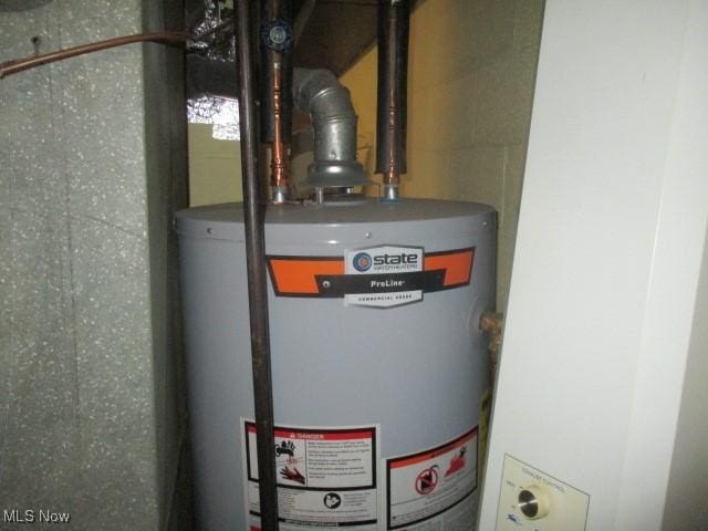 utility room featuring gas water heater