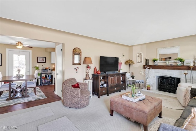 living area featuring a stone fireplace