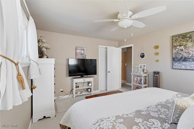 bedroom with baseboards, a closet, and ceiling fan