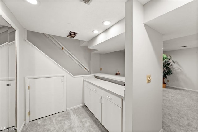 bar featuring baseboards, recessed lighting, visible vents, and light carpet