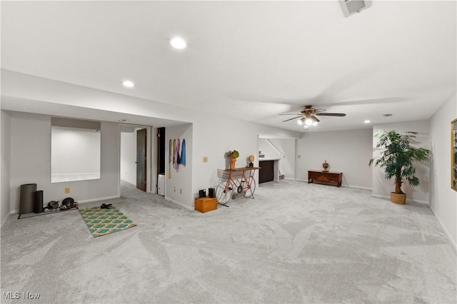 living area featuring recessed lighting, baseboards, carpet, and a ceiling fan