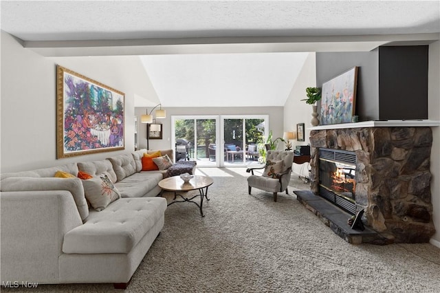 living area featuring lofted ceiling with beams, carpet, and a stone fireplace