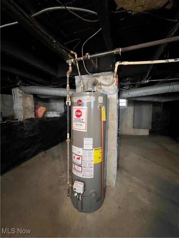 utility room with water heater