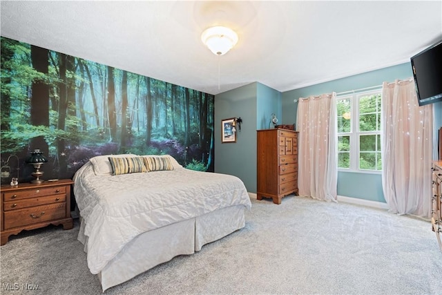 bedroom with carpet flooring and baseboards