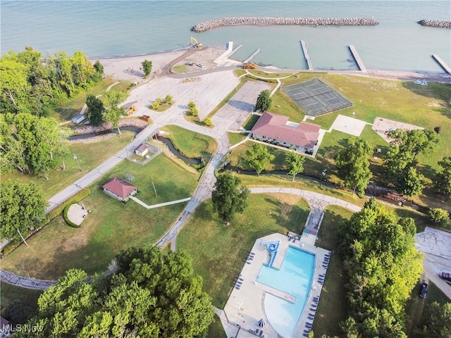 birds eye view of property with a water view