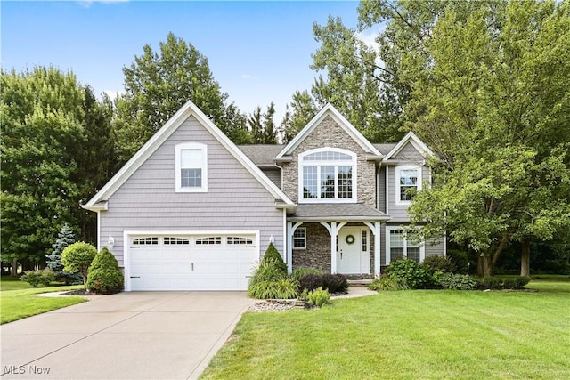 view of front of house featuring a garage, stone siding, concrete driveway, and a front lawn